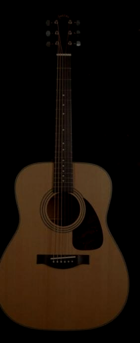Acoustic guitar under a stage light